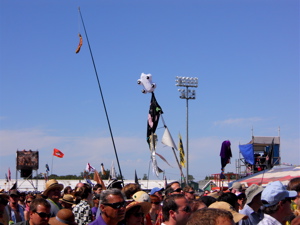 Flags fly out in the fields of the main stages.