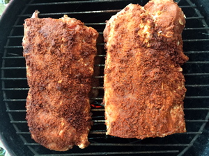With the lower and upper grill surfaces full, the smoker is locked & loaded for action.