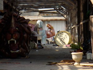 Dilapidated Mardi Gras floats left soaked in storage.